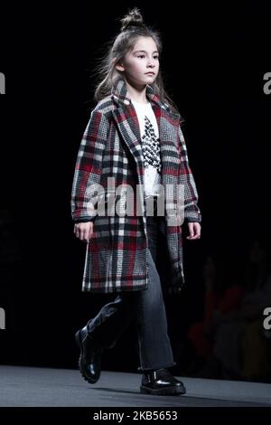 Models walk the runway at the fashion show during the FIMI (Feria Internacional de Moda Infantil y Juvenil) Kids Fashion Week on June 22, 2018 in Madrid, Spain. (Photo by Oscar Gonzalez/NurPhoto) Stock Photo