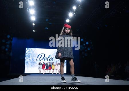 Models walk the runway at the fashion show during the FIMI (Feria Internacional de Moda Infantil y Juvenil) Kids Fashion Week on June 22, 2018 in Madrid, Spain. (Photo by Oscar Gonzalez/NurPhoto) Stock Photo