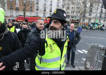 Jerome Rodrigues (C), one of the leading figures of the 'yellow vest' (gilets jaunes) movement, takes part in a march on February 2, 2019 in Paris, France; called to pacifically protest against police violence toward participants of the last three months demonstrations in France, as yellow vest protesters take to the streets for the 12th consecutive saturday today. Rodrigues claimed he was hit by a rubber bullet during clashes at the Bastille square on January 26, but the French junior (Photo by Michel Stoupak/NurPhoto) Stock Photo