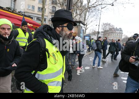 Jerome Rodrigues (C), one of the leading figures of the 'yellow vest' (gilets jaunes) movement, takes part in a march on February 2, 2019 in Paris, France; called to pacifically protest against police violence toward participants of the last three months demonstrations in France, as yellow vest protesters take to the streets for the 12th consecutive saturday today. Rodrigues claimed he was hit by a rubber bullet during clashes at the Bastille square on January 26, but the French junior (Photo by Michel Stoupak/NurPhoto) Stock Photo
