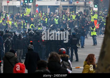 Anti-riot police hold a position during an anti-government demonstration called by the 'Yellow Vest' (Gilets Jaunes) movement in Paris, on February 2, 2019. The 'Yellow Vest' movement called to pacifically protest against police violence toward participants of the last three months demonstrations in France and for the bam of the use by riot police of both 40-millimetre rubber defencive bullet launcher LBD and GLI-F4 stun grenades. (Photo by Michel Stoupak/NurPhoto) Stock Photo