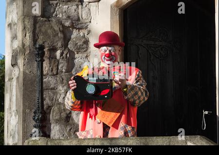 Clowns gather outside the All Saints Church in Haggerston, East London, UK ahead of the 73rd annual service on February 3, 2019. Each year clowns attend this special mass to commemorate Joseph Grimaldi (1778-1837) known as the 'father' of conterporary clowning. (Photo by WIktor Szymanowicz/NurPhoto) Stock Photo