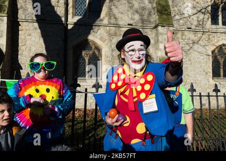 Clowns gather outside the All Saints Church in Haggerston, East London, UK ahead of the 73rd annual service on February 3, 2019. Each year clowns attend this special mass to commemorate Joseph Grimaldi (1778-1837) known as the 'father' of conterporary clowning. (Photo by WIktor Szymanowicz/NurPhoto) Stock Photo