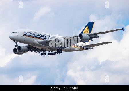 Singapore Airlines Airbus A380 double decker aircraft seen on final approach landing, during a summer day with clouds, at London Heathrow International Airport LHR EGLL on 23 August 2019. The wide body airplane has 4x RR Trent 970 jet engines and registration 9V-SKP. Singapore Airlines SQ SIA is the flag carrier airline of Singapore and is based with hub at Changi Airport SIN WSSS offering daily connections to the British capital. ranked as the world's best airline in 2018 and is member of Star Alliance aviation alliance. (Photo by Nicolas Economou/NurPhoto) Stock Photo