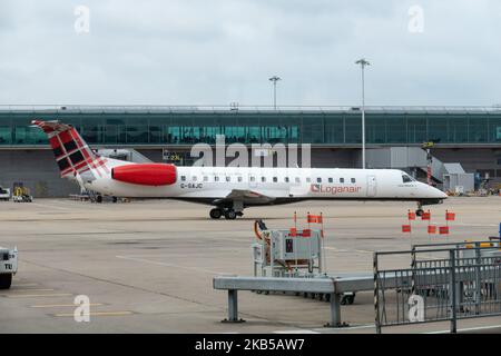 Loganair Embraer ERJ-145 aircraft as seen taxiing at London Stansted International Airport STN EGSS in England, UK on 1st August 2019. The regional jet airplane has registration G-SAJC and is flying since June 2000, for British Midland, then bmi Regional until Dec. 2018. Loganair Scotland's Airline LM LOG has a base at Glasgow. The carrier connects the British capital to Derry and Dundee. (Photo by Nicolas Economou/NurPhoto) Stock Photo