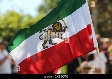Iranian flag seen during the first ever Persian parade in Toronto, Ontario, Canada, on August 31, 2019. The parade showcased traditional costumes that illustrated the diverse cultural traditions and history of Iran. (Photo by Creative Touch Imaging Ltd./NurPhoto) Stock Photo