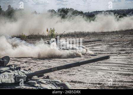 The tactical training for the tank forces of the Ukrainian Army performs at the proving grounds in Honcharivske, Chernihiv Oblast, Ukraine, on September 7, 2019. During the technical demonstration of the tanks, the units were firing with live ammunition and showed the practical use of the anti-tank missiles. Based on the training results, the best tank units were awarded the trophies and the diplomas. (Photo by Oleksandr Rupeta/NurPhoto) Stock Photo