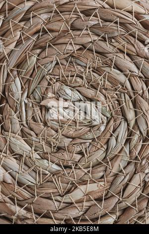 Abstract wicker seagrass basket texture background. Circle spiral pattern. Bottom of natural home storage basket. Close up, circle spiral pattern Stock Photo
