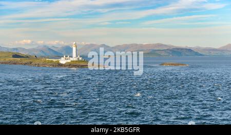 Lismore Lighthouse at the southern tip of Lismore Island viewed from the Oban to Mull Ferry and showing the narrows Stock Photo