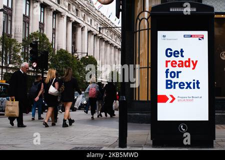 A 'Get ready for Brexit' sign, part of a huge government advertising campaign launched ahead of Britain's scheduled October 31 departure from the EU, lights up an information screen on the corner of North Audley Street and Oxford Street in London, England, on September 10, 2019. MPs last night voted for a second time to deny Prime Minister Boris Johnson a general election before Britain's scheduled departure from the European Union on October 31. Speaking ahead of the vote, the prime minister insisted that he would not ask the EU for any further extension to Brexit, leaving him now with few op Stock Photo