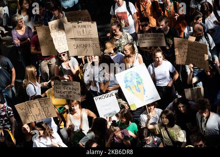 Top view of the procession of young demonstrators holding signs for the climate emergency on which slogans such as 'Winter is not coming' or 'Your planet, blue or bleeding?' can be read, this Friday, September 20, 2019 in Paris as part of the global strike day for the climate and the movement initiated by Greta Thunberg 'Friday for Future' and organized by the Youth for Climate movement. In Paris, about 9400 young people gathered at Place de la Nation to go to the Bercy garden with numerous signs and slogans reminding the governments of the climate emergency and denouncing their inaction. (Pho Stock Photo