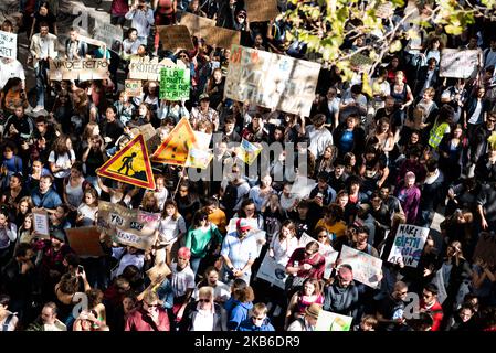 Top view of the procession of young demonstrators holding signs for the climate emergency on which slogans such as 'No climate, no chocolate' or 'Make the earth cool again' can be read, this Friday, September 20, 2019 in Paris as part of the global strike day for the climate and the movement initiated by Greta Thunberg 'Friday for Future' and organized by the Youth for Climate movement. In Paris, about 9400 young people gathered at Place de la Nation to go to the Bercy garden with numerous signs and slogans reminding the governments of the climate emergency and denouncing their inaction. (Phot Stock Photo
