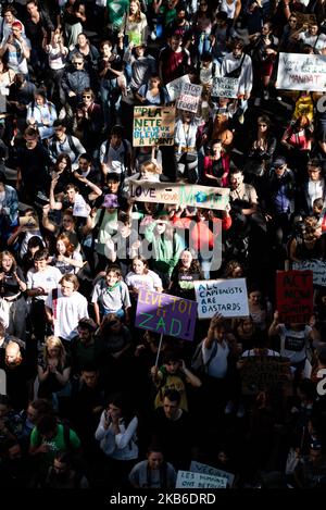 Top view of the procession of young demonstrators holding signs for the climate emergency on which slogans such as 'Love your mother' or 'All Capitalists Are Bastards (ACAB)' can be read, this Friday, September 20, 2019 in Paris as part of the global strike day for the climate and the movement initiated by Greta Thunberg 'Friday for Future' and organized by the Youth for Climate movement. In Paris, about 9400 young people gathered at Place de la Nation to go to the Bercy garden with numerous signs and slogans reminding the governments of the climate emergency and denouncing their inaction. (Ph Stock Photo