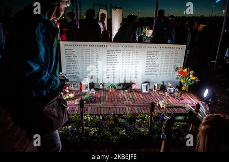 This year, 75 years after Operation Market Garden, the Dutch city of Nijmegen celebrate 75 Years of freedom, in Nijmegen, Netherlands, on September 21, 2019. During this Sunset March, they gave special attention to the 48 allied soldiers who died 75 years ago during the heroic crossing of the Waal river. 48 light towers turned on and at the same time, 48 light rays illuminated the sky. This tribute to them was supported by an opera spectacle from the water. The Sunset March ends at the Waalcrossing monument, where people could leave flowers. (Photo by Romy Arroyo Fernandez/NurPhoto) Stock Photo