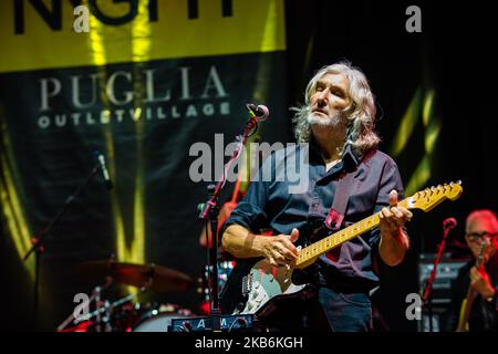 The famous Dire Straits Legacy band in concert in Molfetta at the Puglia Outlet Village on September 21st 2019. The band formed by historical components, Alan Clark (keyboards, hammond and choirs), Jack Sonni & Phil Palmer (guitars & vocals), together with Trevor Horn (bass) Andy Treacy (drums), Andy Hamilton (Sax), plus the Italians Marco Caviglia (vocals and guitar) and Primiano DiBiase (keyboards). (Photo by Davide Pischettola/NurPhoto) Stock Photo