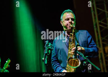 The famous Dire Straits Legacy band in concert in Molfetta at the Puglia Outlet Village on September 21st 2019. The band formed by historical components, Alan Clark (keyboards, hammond and choirs), Jack Sonni & Phil Palmer (guitars & vocals), together with Trevor Horn (bass) Andy Treacy (drums), Andy Hamilton (Sax), plus the Italians Marco Caviglia (vocals and guitar) and Primiano DiBiase (keyboards). (Photo by Davide Pischettola/NurPhoto) Stock Photo