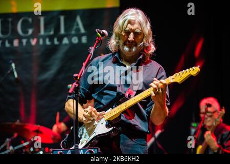 The famous Dire Straits Legacy band in concert in Molfetta at the Puglia Outlet Village on September 21st 2019. The band formed by historical components, Alan Clark (keyboards, hammond and choirs), Jack Sonni & Phil Palmer (guitars & vocals), together with Trevor Horn (bass) Andy Treacy (drums), Andy Hamilton (Sax), plus the Italians Marco Caviglia (vocals and guitar) and Primiano DiBiase (keyboards). (Photo by Davide Pischettola/NurPhoto) Stock Photo