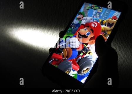 Smart phone with the MARIO KART TOUR logo, is a popular game for phones.  United States, Canada, December 4, 2019 Stock Photo - Alamy