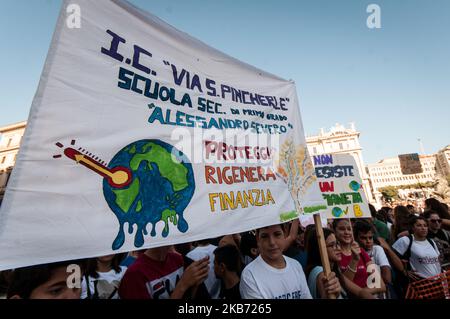 Students demonstrate during a worldwide protest demanding action on climate change, in Rome, Friday, Sept. 27, 2019. The protests are inspired by Swedish teenager Greta Thunberg, who spoke to world leaders at a United Nations summit this week. Writing on banner reads in Italian' 'Change the system, not the climateon. September 27, 2019 in Rome, Italy. (Photo by Andrea Ronchini/NurPhoto) Stock Photo