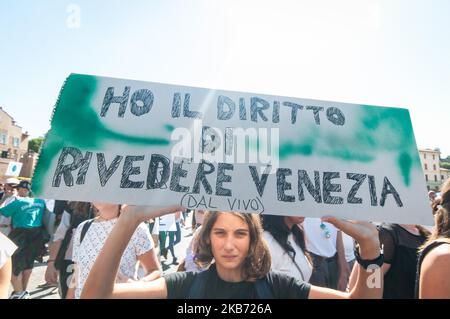 Students demonstrate during a worldwide protest demanding action on climate change, in Rome, Friday, Sept. 27, 2019. The protests are inspired by Swedish teenager Greta Thunberg, who spoke to world leaders at a United Nations summit this week. Writing on banner reads in Italian' 'Change the system, not the climateon. September 27, 2019 in Rome, Italy. (Photo by Andrea Ronchini/NurPhoto) Stock Photo