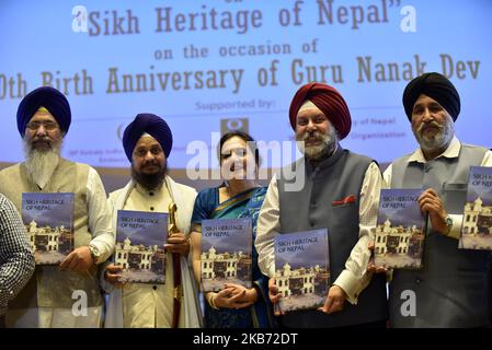 (L-R) SGPC president Gobind Singh Longowal, Harpreet Singh Jathedar Akal Takht, Golden Temple Amritsar and Indian Ambassador to Nepal Manjeev Singh Puri jointly release Publication on Sikh Heritage of Nepal on the occasion of 550th Birthday Anniversary of Guru Nanak Dev at Kathmandu, Nepal on Friday, September 27, 2019. Government of Nepal has issues commemorative coins of NPR 2500, 1000 and 100. (Photo by Narayan Maharjan/NurPhoto) Stock Photo