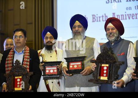 (L-R) Governor, Nepal Rastra Bank, Dr. Chiranjibi Nepal, Harpreet Singh Jathedar Akal Takht, Golden Temple Amritsar, SGPC president Gobind Singh Longowal and Indian Ambassador to Nepal Manjeev Singh Puri jointly launch Commemorative Coins of Guru Nanak Dev and release of Publication on Sikh Heritage of Nepal on the occasion of 550th Birthday Anniversary of Guru Nanak Dev at Kathmandu, Nepal on Friday, September 27, 2019. Government of Nepal has issues commemorative coins of NPR 2500, 1000 and 100. (Photo by Narayan Maharjan/NurPhoto) Stock Photo