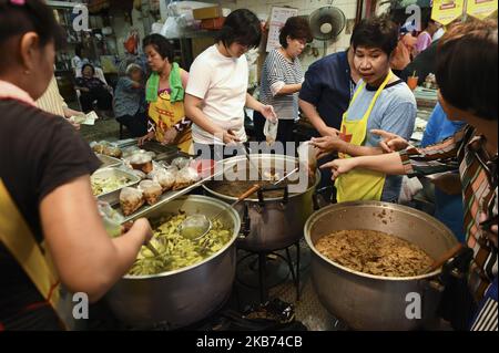 People shop for vegetarian food at market in Chinatown, Bangkok,Thailand. 28 September 2019. (Photo by Anusak Laowilas/NurPhoto) Stock Photo
