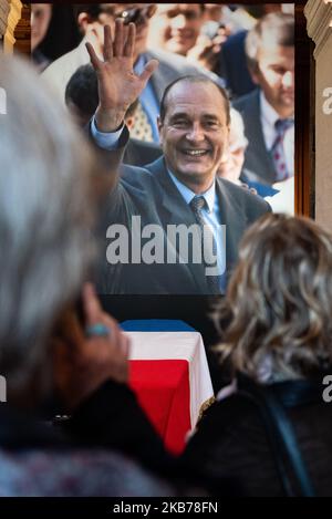 On Sunday, September 29, 2019, French people gather in front of the coffin of the former President of the Republic overhung by a huge portrait where he greets the crowd in the courtyard of the Hotel des Invalides where the French are invited to pay a last tribute to Jacques Chirac who died 3 days earlier on September 26, the family and the Elysée organized a great day of popular tribute to Jacques Chirac at the Hotel des Invalides in Paris. For the occasion, the coffin of the former President of the Republic was exposed to the public in front of the entrance of the church where thousands of Fr Stock Photo