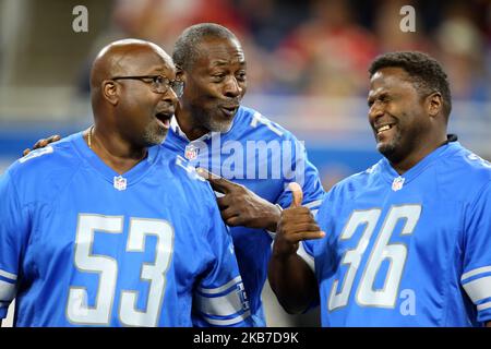 Former Detroit Lions center Kevin Glover (53), former Detroit Lions offensive tackle Lomas Brown (75), and former Detroit Lions safety Bennie Blades (36) joke around during a ceremony honoring the Lions All Time Team during halftime of an NFL football game against the Kansas City Chiefs in Detroit, Michigan USA, on Sunday, September 29, 2019. (Photo by Amy Lemus/NurPhoto) Stock Photo