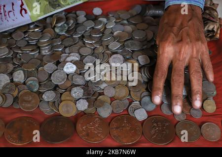 A man selling antique coins waits for the customers in New Delhi India on 05 October 2019 (Photo by Nasir Kachroo/NurPhoto) Stock Photo