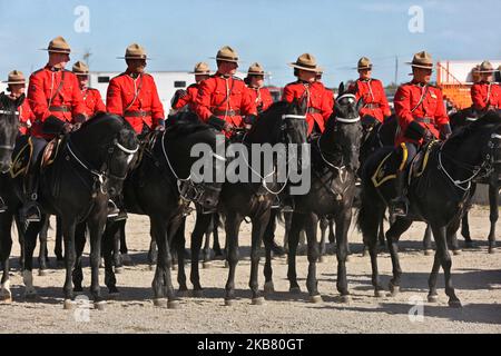 Members of the RCMP (Royal Canadian Mounted Police) perform on horseback during the RCMP Musical Ride in Markham, Ontario, Canada, on October 05, 2019. The Musical Ride of the Royal Canadian Mounted Police is an event showcasing the equestrian skills performed by 32 cavalry who are regular members of the police force. (Photo by Creative Touch Imaging Ltd./NurPhoto) Stock Photo