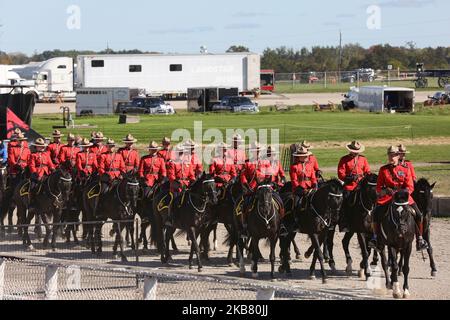 Members of the RCMP (Royal Canadian Mounted Police) perform on horseback during the RCMP Musical Ride in Markham, Ontario, Canada, on October 05, 2019. The Musical Ride of the Royal Canadian Mounted Police is an event showcasing the equestrian skills performed by 32 cavalry who are regular members of the police force. (Photo by Creative Touch Imaging Ltd./NurPhoto) Stock Photo