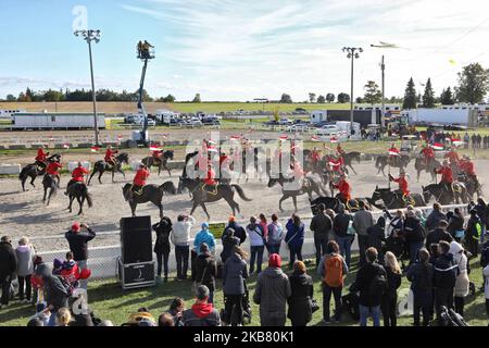 Members of the RCMP (Royal Canadian Mounted Police) perform on horseback during the RCMP Musical Ride in Markham, Ontario, Canada, on October 05, 2019. The Musical Ride of the Royal Canadian Mounted Police is an event showcasing the equestrian skills performed by 32 cavalry who are regular members of the police force. (Photo by Creative Touch Imaging Ltd./NurPhoto) Stock Photo