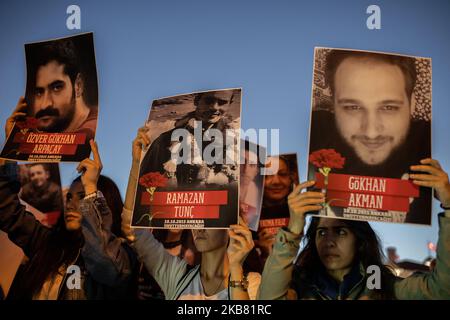 On October 10, 2019, leftist and opposing organizations, and families of the victims gathered in Istanbul to commemorate the October 10, 2015 Ankara Bombing. The crowd chanted anti-war slogans protesting the ongoing attacks of Turkey towards the Kurds near the Syrian border. While the press release was being read, Turkish riot police violently attacked the crowd with tear gas and many people have been taken under custody. Protestors holding pictures of the 2015 Ankara Bombing victims. (Photo by Erhan Demirtas/NurPhoto) Stock Photo