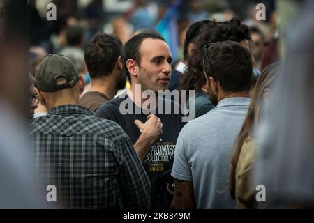 Italian cartoonist Michele Rech, also known as Zerocalcare, signs a copy of  a book by him to a fan Stock Photo - Alamy