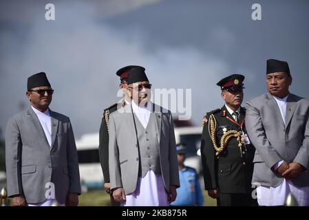 (L-R) Chairman of the National Assembly Ganesh Prasad Timilsina, Prime Minister KP Sharma Oli and Vice-president of Nepal Nanda Kishor Pun arrives to give farewell to Chinese President returning home after completing the two-day state visit of Nepal on Sunday, October 13, 2019. (Photo by Narayan Maharjan/NurPhoto) Stock Photo