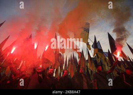 Men in uniforms lit flares during a rally against surrender in Kyiv, Ukraine, October 14, 2019. Several Thousand Ukrainians attend the March Against Capitulation and Surrender of State Interests on October 14, when Ukraine marks the Day of Defender. (Photo by Sergii Kharchenko/NurPhoto) Stock Photo