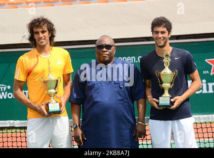 Tunisians Aziz Dougaz and Skander Monsouri pose with trophy after winners of the Men's Double final against Zimbabwe brothers, Benjamin Lock and Courtney Lock on 14th October 2019 in Lagos, Nigeria. (Photo by Olukayode Jaiyeola/NurPhoto) Stock Photo