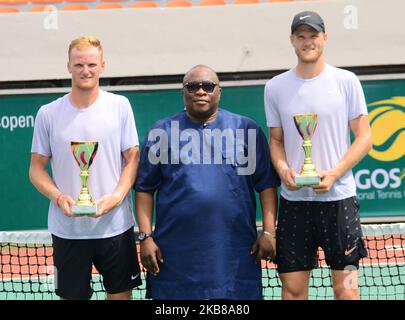 Zimbabwe brothers, Benjamin Lock (L) and Courtney Lock (R) pose with second place trophy after they was defeated by Tunisians Aziz Dougaz and Skander Monsouri during the Men's Double final on 14th October 2019 in Lagos, Nigeria. (Photo by Olukayode Jaiyeola/NurPhoto) Stock Photo