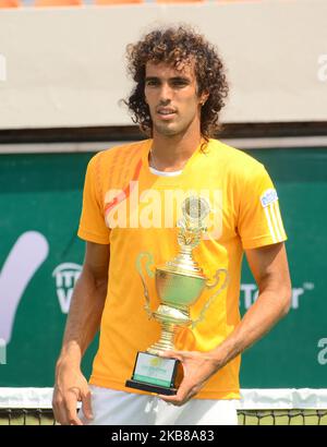 Tunisian Skander Monsouri poses with trophy after winners of the Men's Double final against Zimbabwe brothers, Benjamin Lock and Courtney Lock on 14th October 2019 in Lagos, Nigeria. (Photo by Olukayode Jaiyeola/NurPhoto) Stock Photo