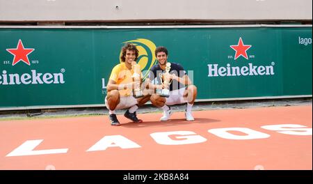 Tunisians Aziz Dougaz and Skander Monsouri pose with trophy after winners of the Men's Double final against Zimbabwe brothers, Benjamin Lock and Courtney Lock on 14th October 2019 in Lagos, Nigeria. (Photo by Olukayode Jaiyeola/NurPhoto) Stock Photo