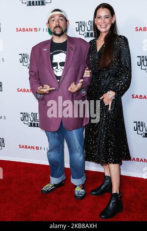 HOLLYWOOD, LOS ANGELES, CALIFORNIA, USA - OCTOBER 14: Kevin Smith and Jennifer Schwalbach arrive at the Los Angeles Premiere Of Saban Films' 'Jay and Silent Bob Reboot' held at the TCL Chinese Theatre IMAX on October 14, 2019 in Hollywood, Los Angeles, California, United States. (Photo by David Acosta/Image Press Agency/NurPhoto) Stock Photo