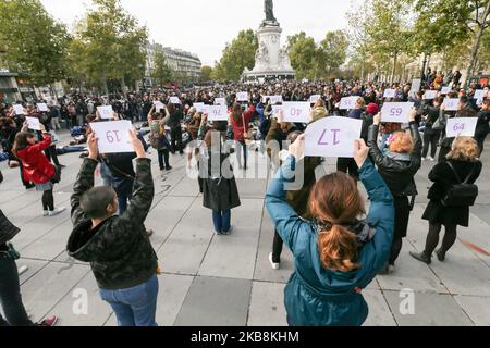 Women hold placards reading names of women victims of femicide place de la Republique, in Paris, during a 'die-in' demonstration called by different associations to denounce feminicides in France, on October 19, 2019. 121st victim of a femicide in France in year 2019 died on October 14. (Photo by Michel Stoupak/NurPhoto) Stock Photo