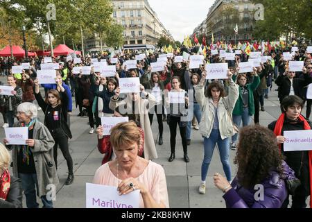 Women hold placards reading names of women victims of femicide place de la Republique, in Paris, during a 'die-in' demonstration called by different associations to denounce feminicides in France, on October 19, 2019. 121st victim of a femicide in France in year 2019 died on October 14. (Photo by Michel Stoupak/NurPhoto) Stock Photo