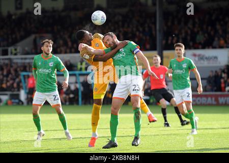 Jamille Matt of Newport County vies Rory McArdle of Scunthorpe United during of Newport during the Sky Bet League Two match between Newport County and Scunthorpe Rodney Parade Stadium in the city of Newport, South Wales, UK, on 19 October 2019. (Photo by MI News/NurPhoto) Stock Photo