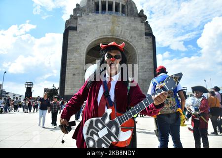 A participant disguised as clown is seen taking part during the march of annual Zombie Walk at Monumento of Revolucion on October 19, 2019 in Mexico City, Mexico (Photo by Eyepix/NurPhoto) Stock Photo