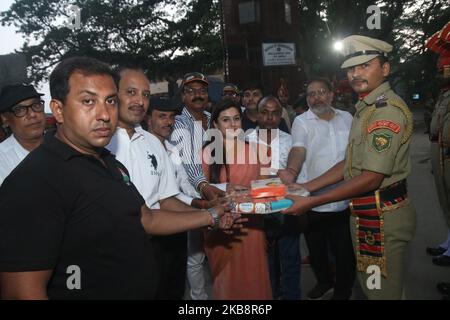 Border Security Forces (BSF ) jawans and Samaryan jointly celebrate Pre Diwali, lit up border with diyas and candles and 1100 diya's,Distribute Sweets etc at India - Bangladesh International border , 72 Indian ,House Wife and children's and BSF Senior officers part in the program at Petrapole-Benapole Border on October 20,2019 in West Bengal,India. Hindu festival 'Diwali', or festival of Lights, which falls on October 27 this year. (Photo by Debajyoti Chakraborty/NurPhoto) Stock Photo