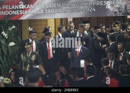 Indonesian President, Joko Widodo (C) and his Vice President, Ma'ruf Amin (R) walking out from the main hall after the Presidential Inauguration Ceremony at the House of Representative building, Jakarta on October 20, 2019. Joko Widodo has been re-elected as Indonesian President for period for 2019-2024 with Ma'ruf Amin as Vice President. (Photo by Aditya Irawan/NurPhoto) Stock Photo