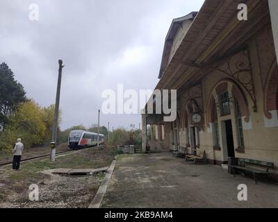 Bulgarians wait for a train at abandoned and almost distroed rail sation in the village if Obiriste and Botevo east of the capifal Sofia during the local elections day. The train station is covered with posters of folk singers and former communist dictator Todor Zhivkov. Many people in the rural areas in the Balkan country still remember with nostalgia the times during communism regime and beleive that one day they will come back. Today in Bulgaria people attend a local elections. (Photo by Petar Petrov/Impact Press Group/NurPhoto) Stock Photo