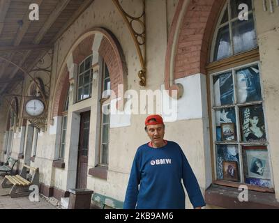 Bulgarians wait for a train at abandoned and almost distroed rail sation in the village if Obiriste and Botevo east of the capifal Sofia during the local elections day. The train station is covered with posters of folk singers and former communist dictator Todor Zhivkov. Many people in the rural areas in the Balkan country still remember with nostalgia the times during communism regime and beleive that one day they will come back. Today in Bulgaria people attend a local elections. (Photo by Petar Petrov/Impact Press Group/NurPhoto) Stock Photo